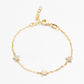 Gold bracelet with star-shaped charms on a white background