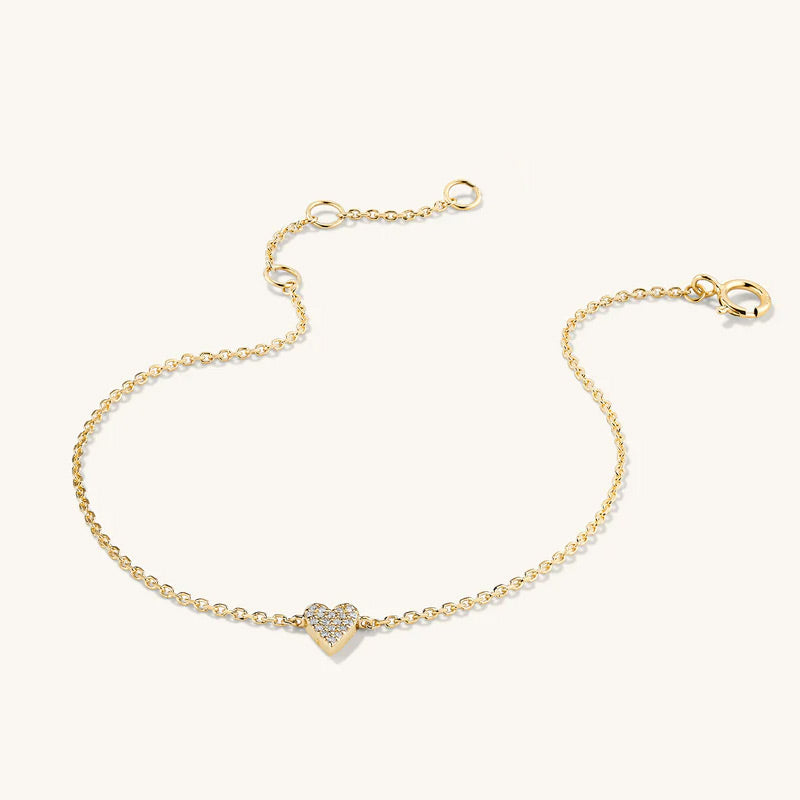 Gold bracelet with a heart-shaped clasp on a white background