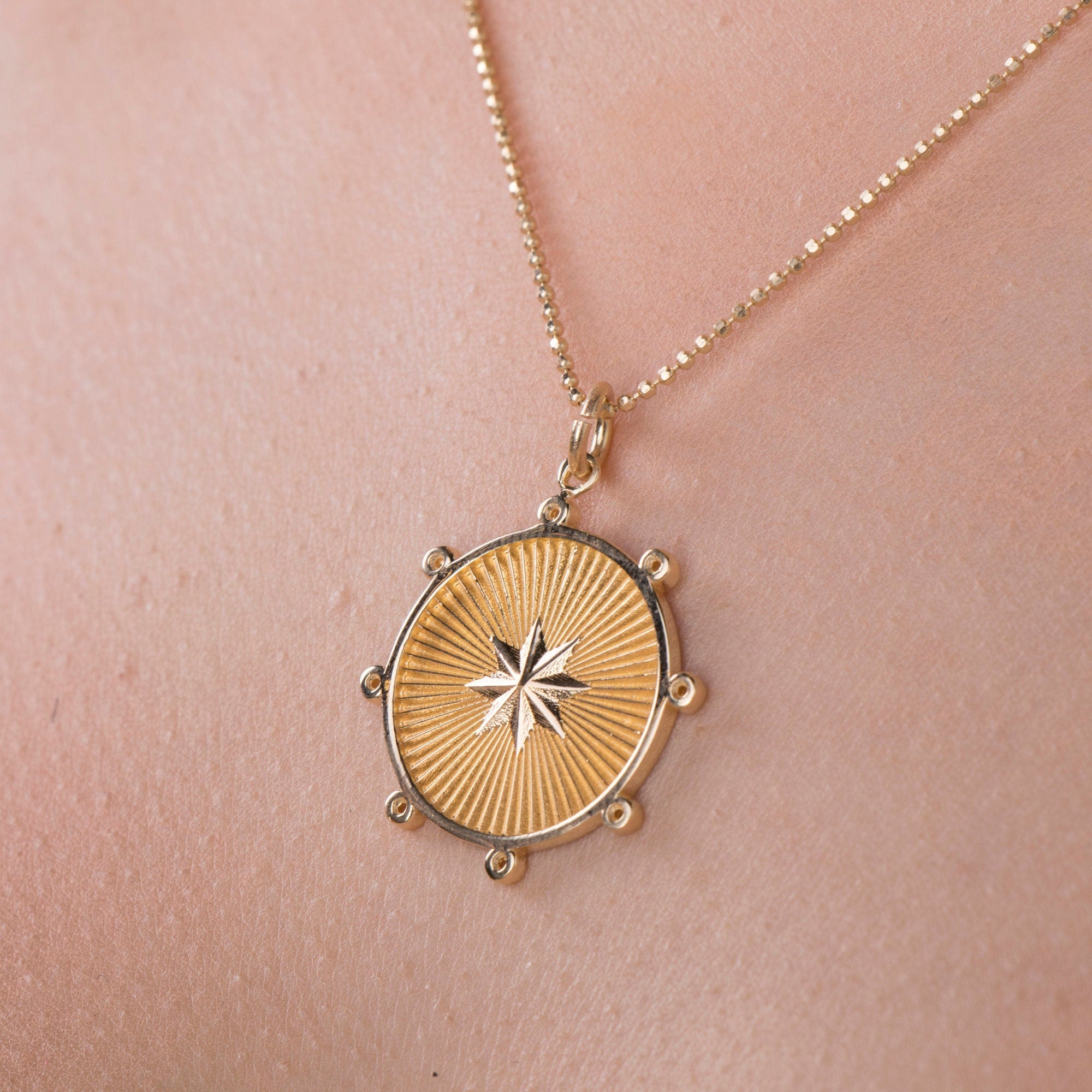 gold starburst necklace