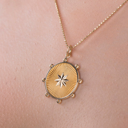 gold starburst necklace
