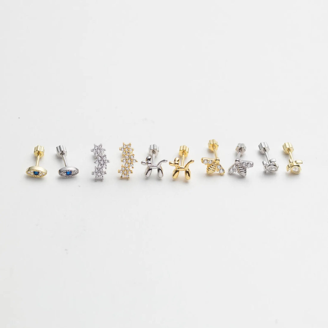 Add a playful yet elegant touch to your ear stack with these Tiny Gold Vermeil Piercing Stud Earrings, available in four unique shapes — Balloon Dog, Turtle, Evil Eye, Star and Bee.
Each piece is crafted in 14K gold vermeil (a thick layer of real 14K gold over 925 sterling silver) for lasting shine and durability, making them perfect for daily wear or mix-and-match layering across multiple piercings.
