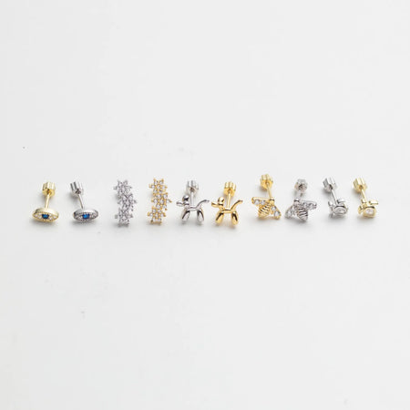 Add a playful yet elegant touch to your ear stack with these Tiny Gold Vermeil Piercing Stud Earrings, available in four unique shapes — Balloon Dog, Turtle, Evil Eye, Star and Bee.
Each piece is crafted in 14K gold vermeil (a thick layer of real 14K gold over 925 sterling silver) for lasting shine and durability, making them perfect for daily wear or mix-and-match layering across multiple piercings.
